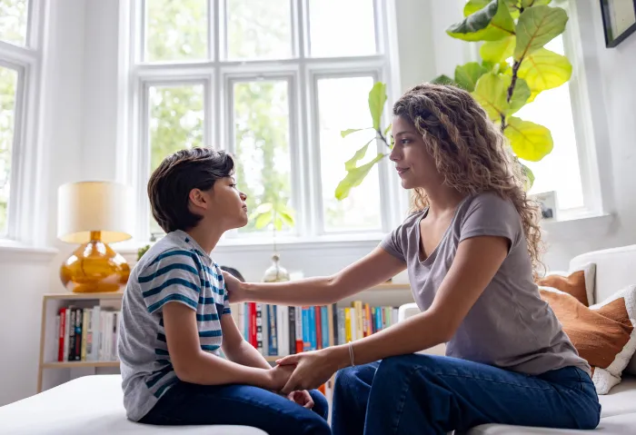 mom calming her child down.